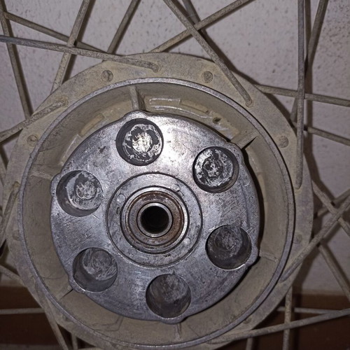 Motorcycle rim used, old with surface rust and missing spoke