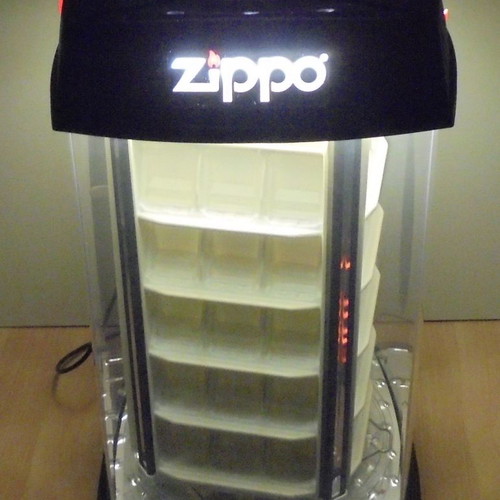 Zippo lighter display stand used, illuminated and rotating with storage base for 60 lighters
