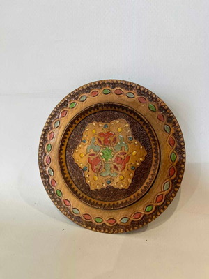 Vintage handmade wooden wall plate with pyrography and folk motif, 12cm