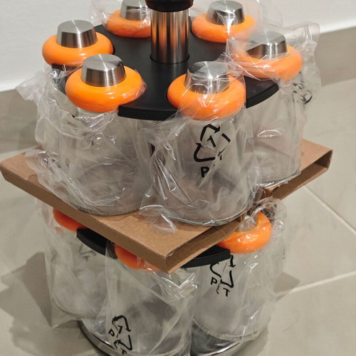 Rotating spice rack with 12 glass containers
