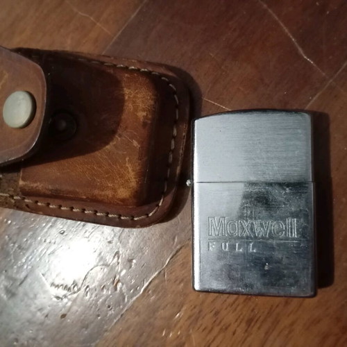 Zippo lighter with used leather case