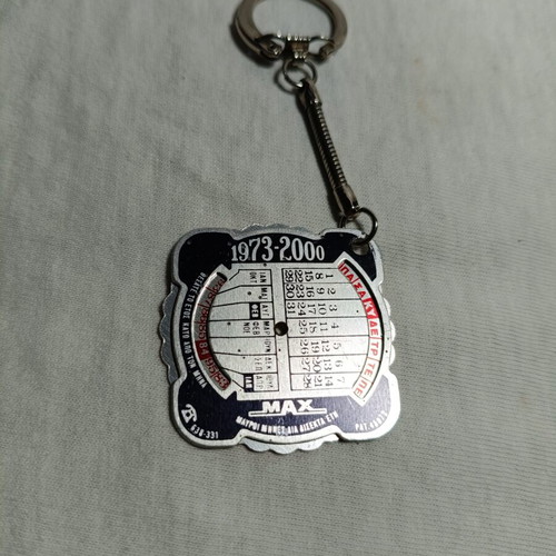 Omega Schools vintage promotional keychain calendar 1973-2000 used