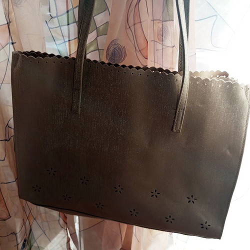 Women's shoulder bag metallic silver with flower cutouts
