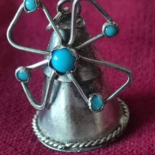 Silver pendant used, windmill shape with turquoise stones