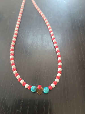 Handmade necklace with white, red beads and turquoise detail