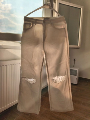 White jeans with knee rips, sizes S-M, wide leg