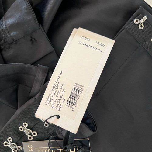 New shiny black pants with a design on the side