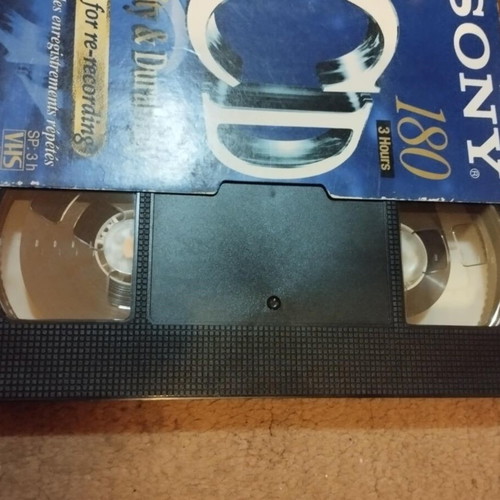 Video cassette used with Love Shots sticker from Elefthero Theatro