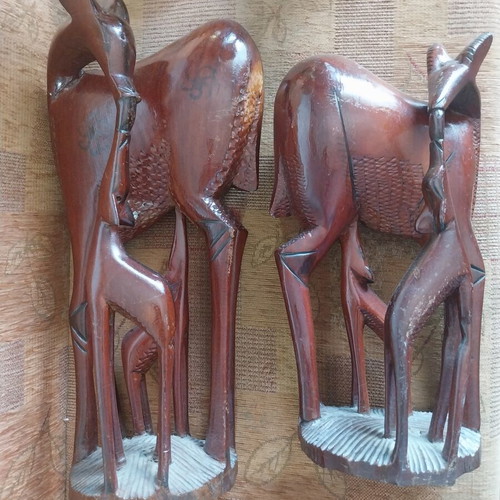 African woodcarvings used, two large gazelle sculptures, mahogany