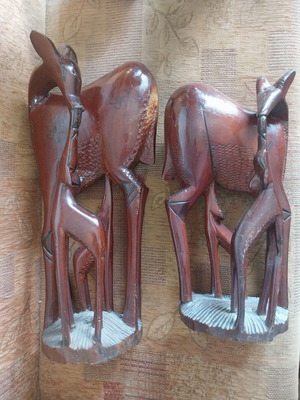 African woodcarvings used, two large gazelle sculptures, mahogany