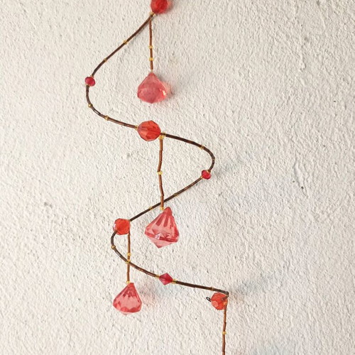 Red fabric decorative tassel used with hanging ornament gift