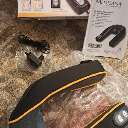 Neck massager used with adjustable intensity and heat function