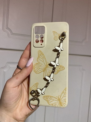 Cream phone case with butterflies used