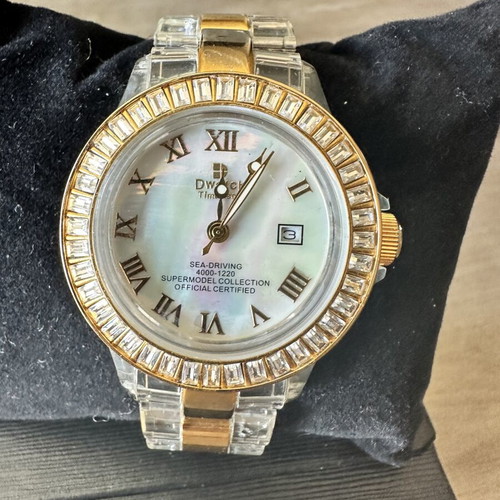 Watch with iridescent crystals like new, zircon and gold