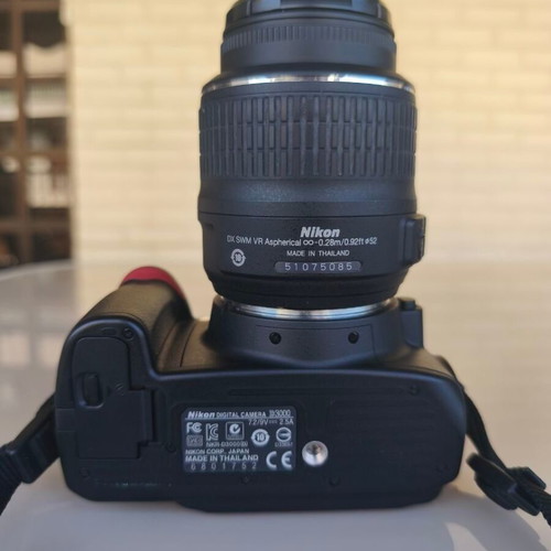 Nikon D3000 camera with AF-S 18-55mm f/3.5-5.6 lens and bag