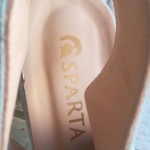 Sparta platforms used, blue with animal print heel