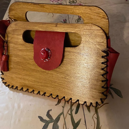 Wooden handmade bag with red leather stitched by hand