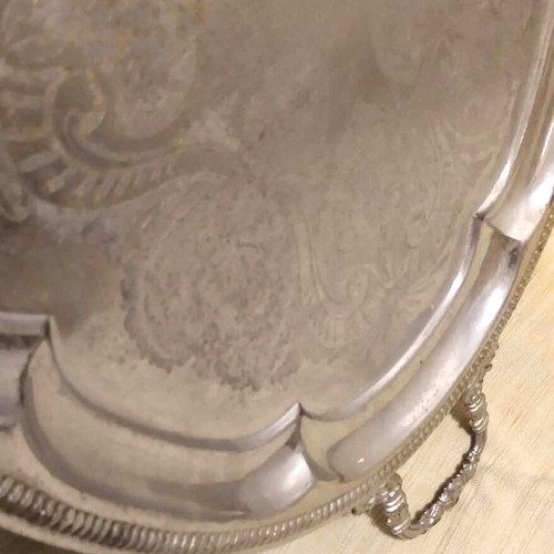 Silver-plated serving tray used with ornate handles