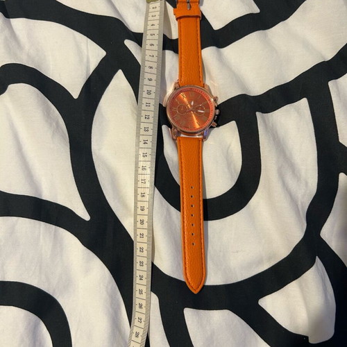 Unisex wristwatch new with orange synthetic leather strap
