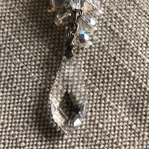 Evening earrings used with beige pearl and crystals