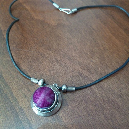 Pendant with purple glass cabochon on leather strap used