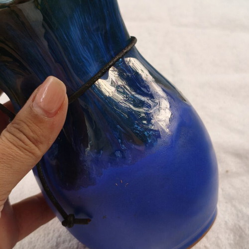 Handmade ceramic vase with blue drip glaze