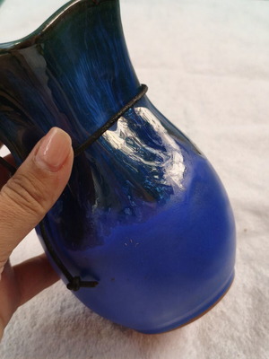 Handmade ceramic vase with blue drip glaze