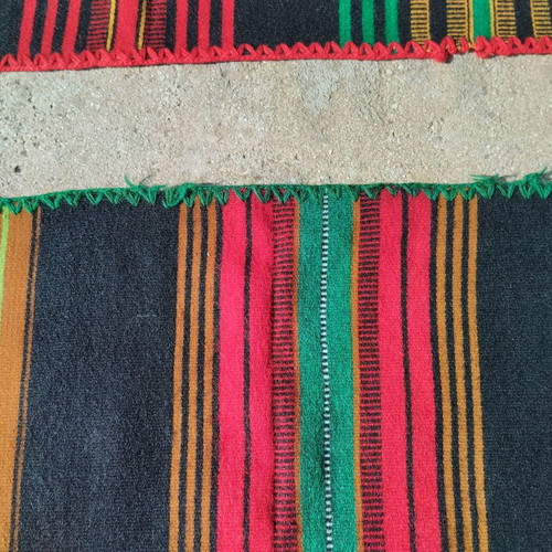 Woven loom runner used with green trim