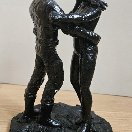 Handmade sculpture of embracing couple