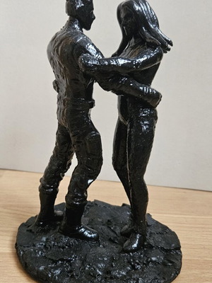 Handmade sculpture of embracing couple
