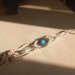 Adjustable belt used, missing one stone