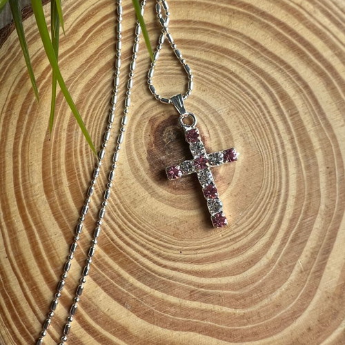 Cross like new with white and pink details