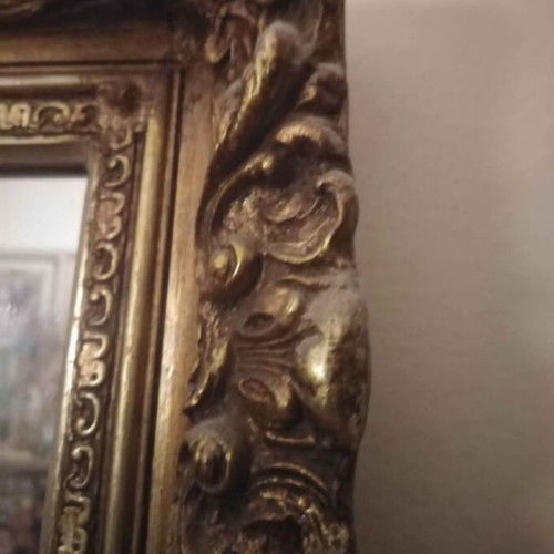 Antique mirror used with carved frame in gold crackle finish