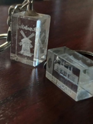 Glass keychains laser engraved from Paris and Ellis Island like new, set of two