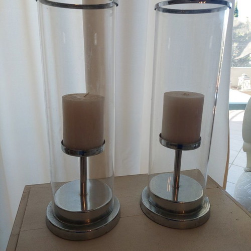 Set of 2 used candlesticks with silver frame and transparent glass