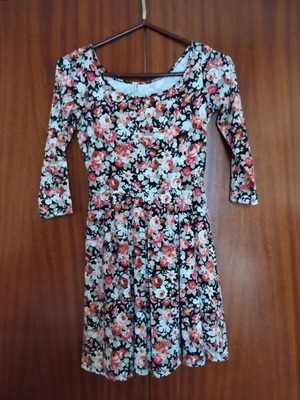 Pink Woman dress size M like new with dark floral pattern and criss-cross back