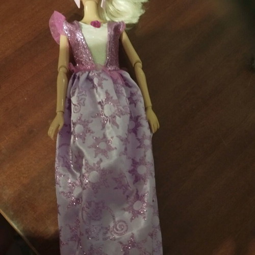Doll with pink earrings and articulated joints used