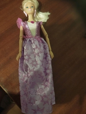 Doll with pink earrings and articulated joints used