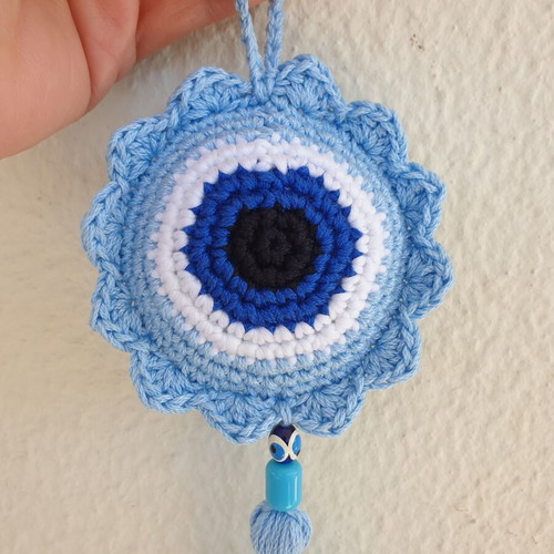 Handmade baby blue crocheted eye decoration