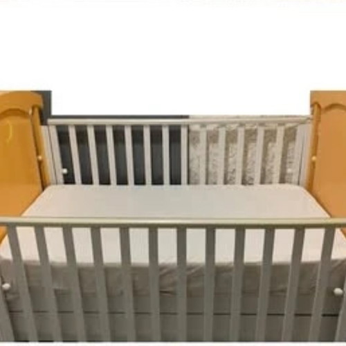Children's cot and mattress used with drawer and adjustable rails