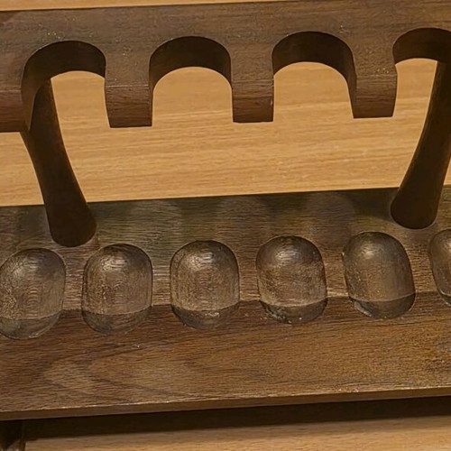 Handmade wooden pipe stand used for six