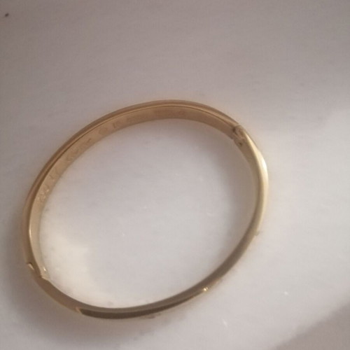 Steel bracelet with clip and rhinestones, gold color