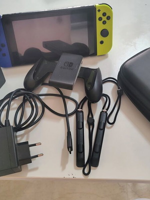 Nintendo Switch console with accessories and carrying case