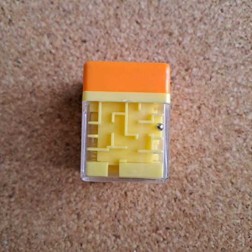 Labyrinth stamp like new, small orange with toy