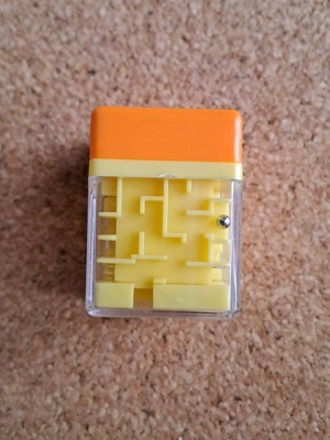 Labyrinth stamp like new, small orange with toy