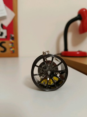 Car wheel keychain new black with yellow caliper