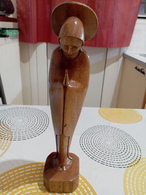 Handmade wooden Madonna statue in praying pose with halo