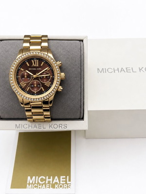 Michael Kors women's gold wristwatch with brown dial and chronograph
