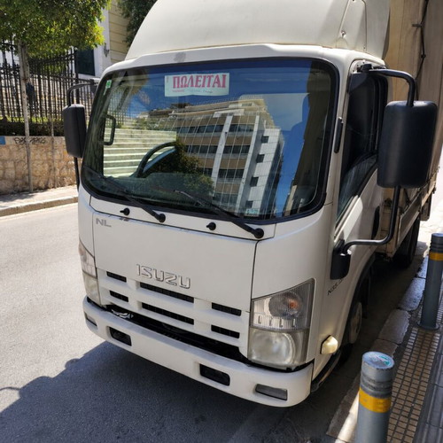 Isuzu truck 2012 used with open cargo bed, ready for work