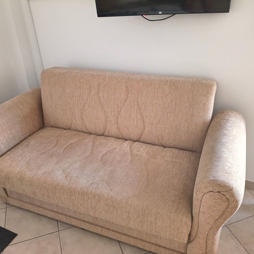 Two-seater sofa bed, beige fabric with storage